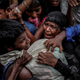 Rohingya refugees scramble for aid at a camp in Cox’s Bazar, Bangladesh, Sept. 24, 2017.